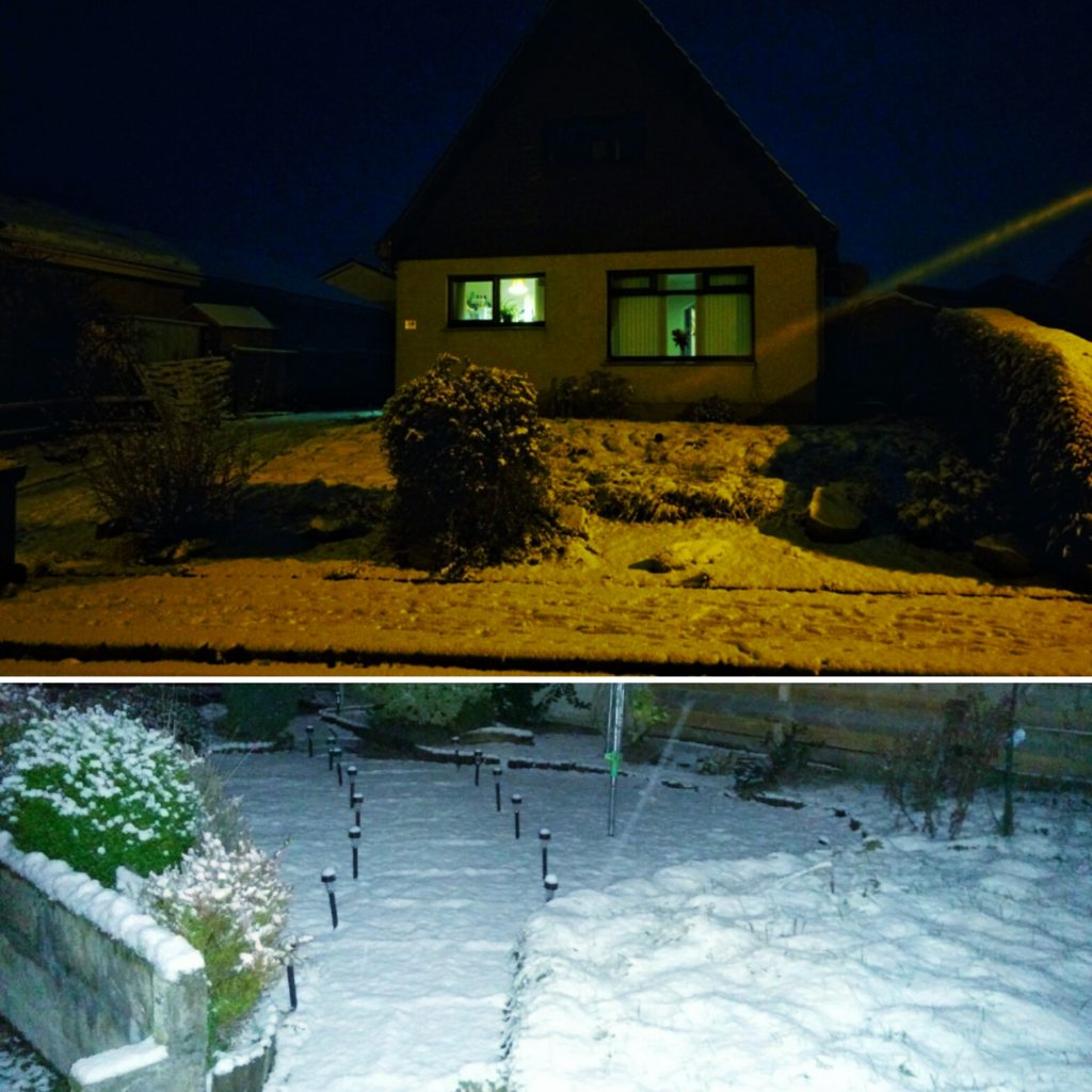 A house with a snow-covered garden in Scotland.