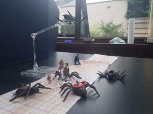 A Dungeons and Dragons battle with four players against five spiders.